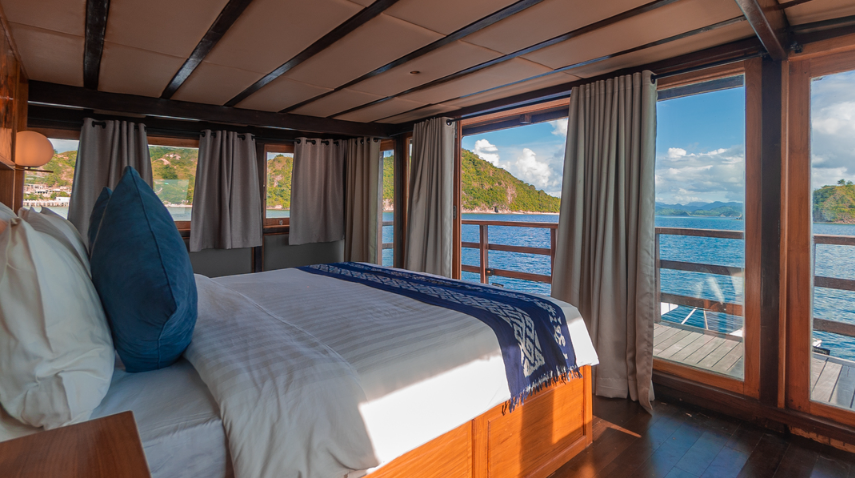 Book Private Trip by Revfiero Luxury Phinisi 2026 - Master Cabin Balcony