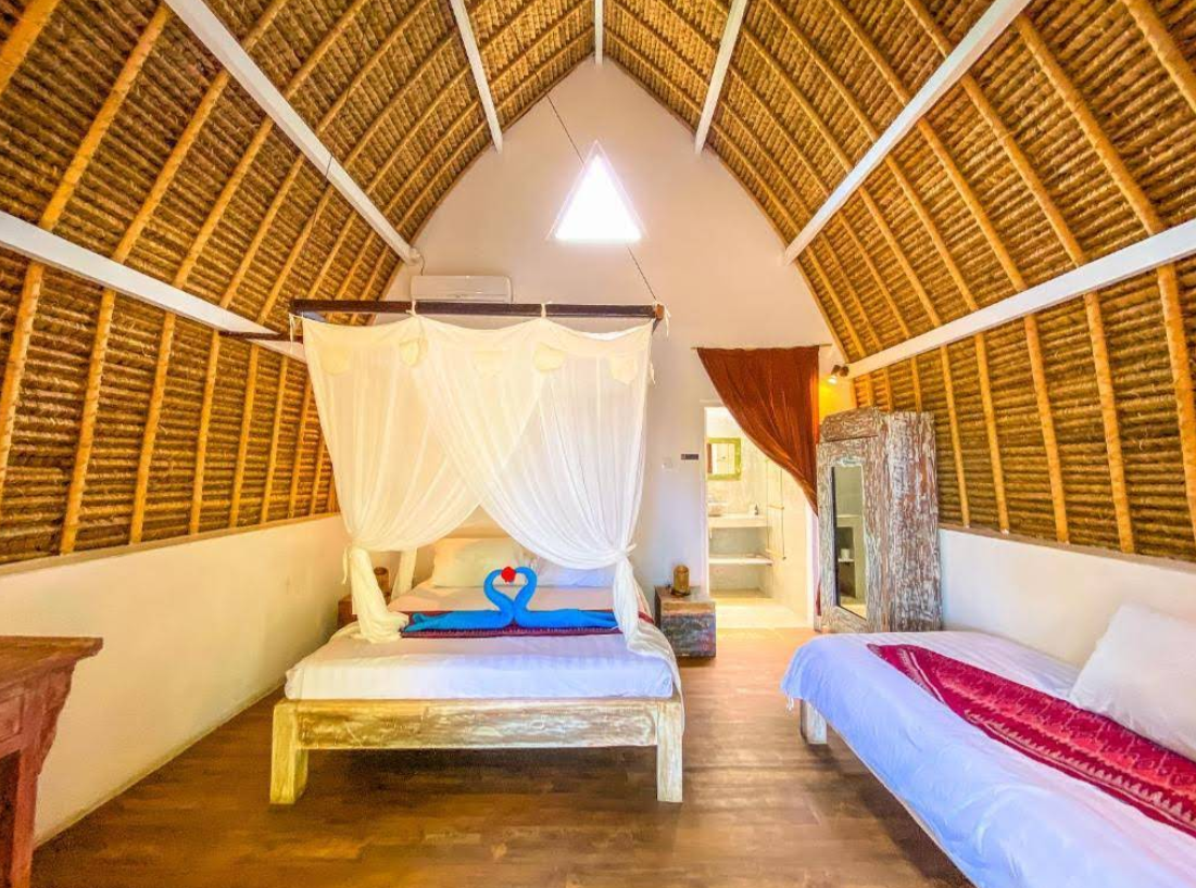View of West Nusa Penida sunset views from this Sakti eco-resort. 2 Book Namaste Bungalows Nusa Penida 2026